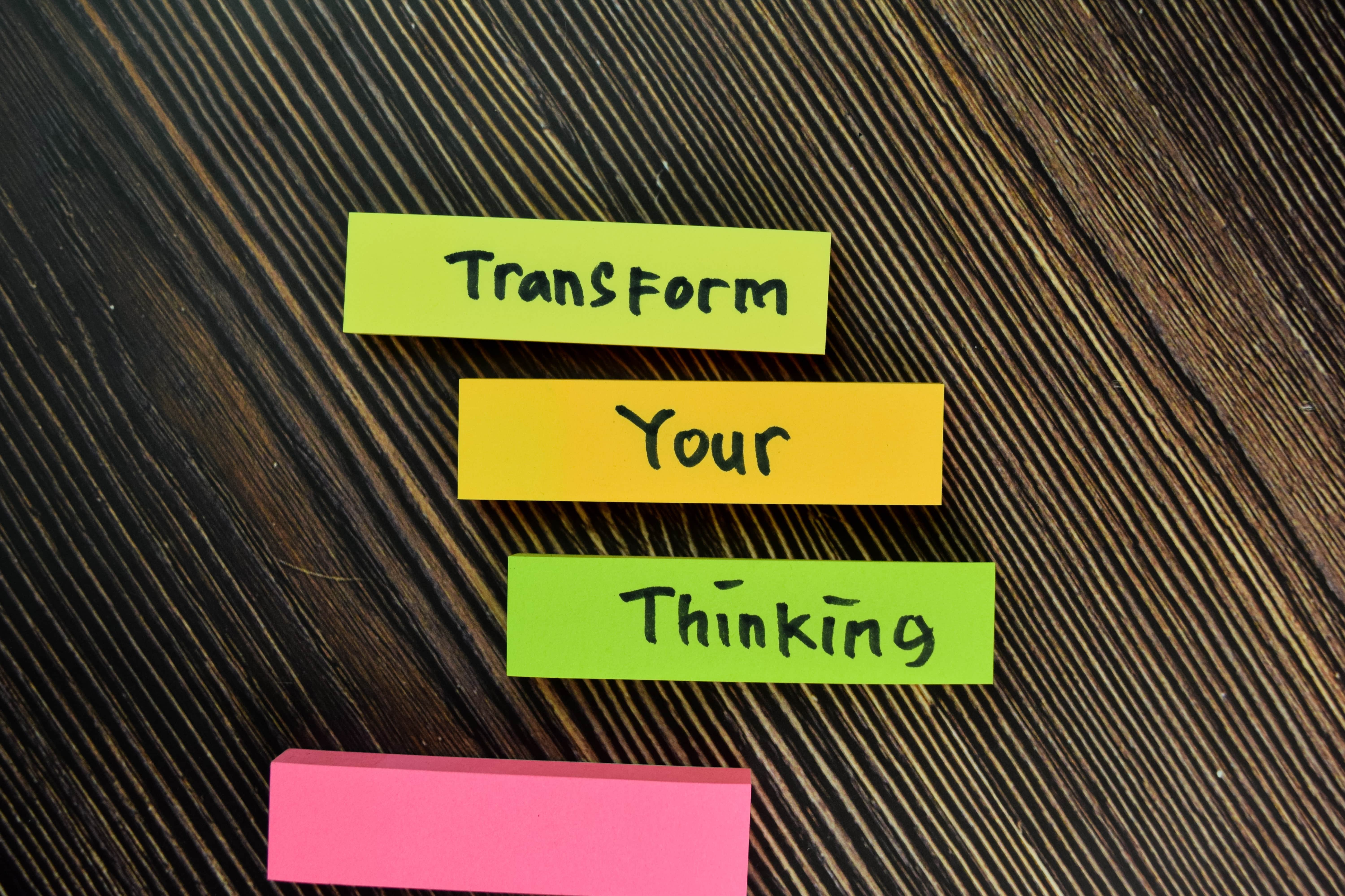 vecteezy_transform-your-thinking-written-on-small-notes-isolated-on-wooden-table_2219931-min